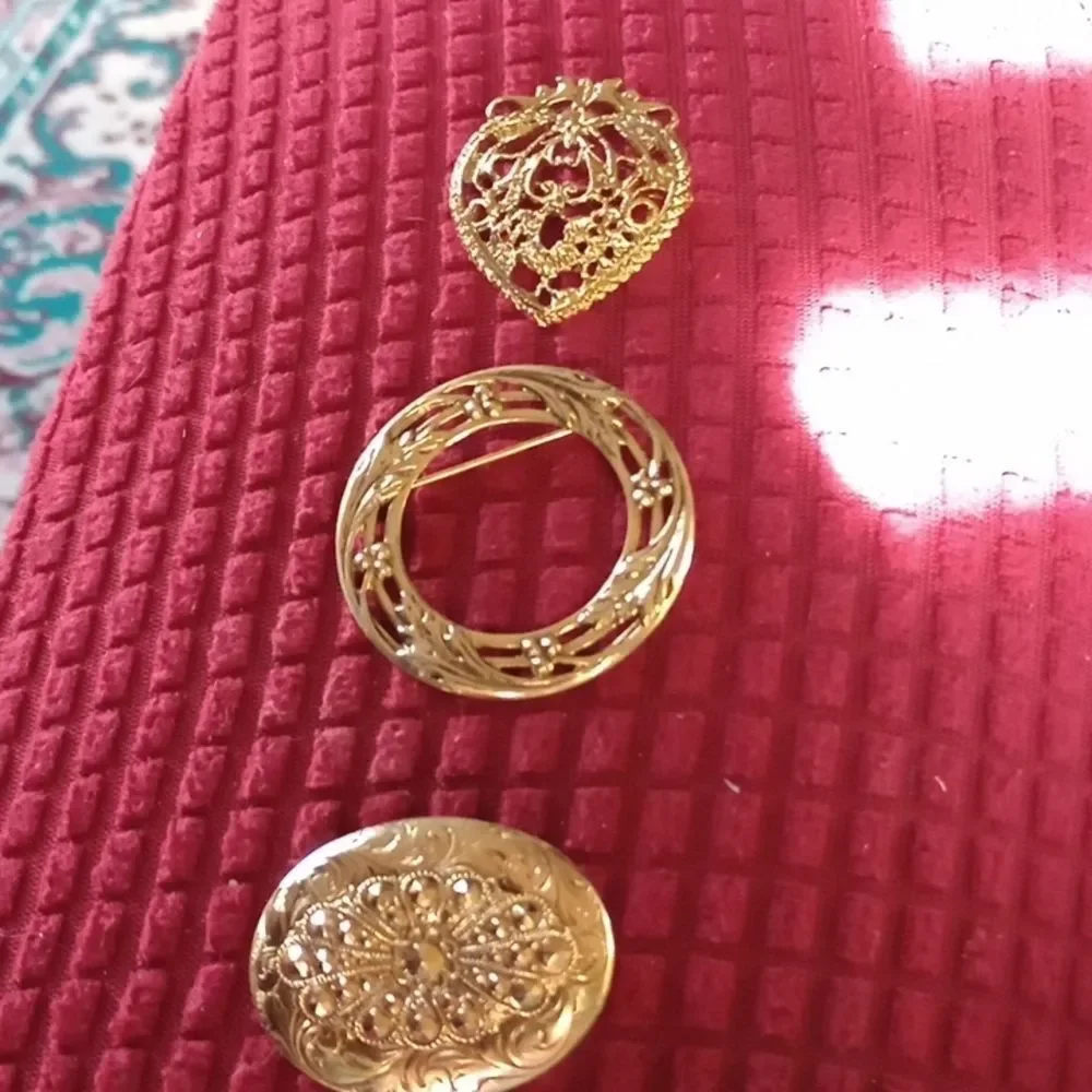 Three vintage brooches